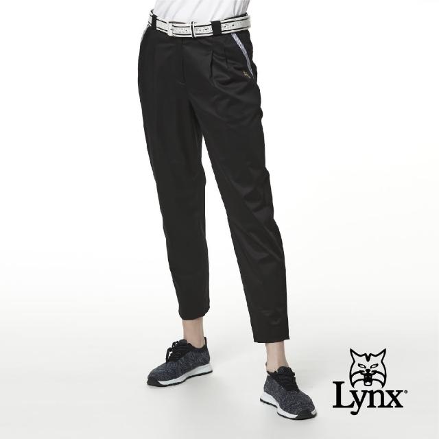 【Lynx Golf】女款彈性舒適草寫字體前袋配布設計打摺九分褲(黑色)